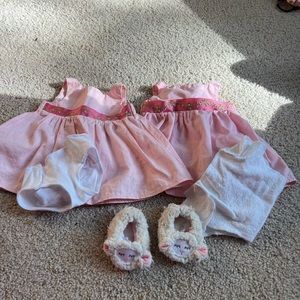 Good condition Bitty Baby dress(x2), diaper(x2) and sheep slippers.